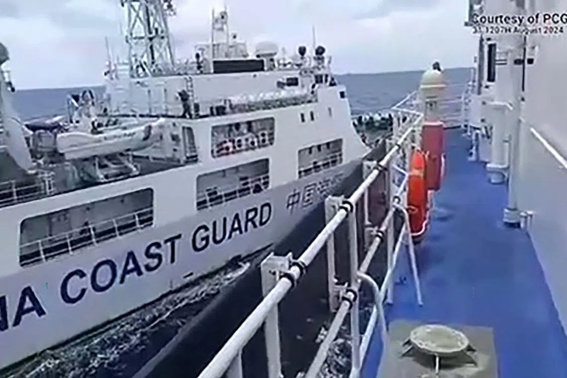 This frame grab from handout video footage taken and released on August 31, 2024 by the Philippine Coast Guard (PCG) shows a Chinese coast Guard ship (L) colliding with Philippine Coast Guard ship BRP Teresa Magbanua near the Sabina Shoal in disputed waters of the South China Sea. Beijing accused a Philippine ship of deliberately running into a Chinese coast guard vessel on August 31 near a flashpoint shoal in the South China Sea, the latest in a spate of similar incidents in recent weeks. (Photo by Handout / Philippine Coast Guard (PCG) / AFP) / RESTRICTED TO EDITORIAL USE - MANDATORY CREDIT "AFP PHOTO / PHILIPPINE COAST GUARD (PCG)" - NO MARKETING NO ADVERTISING CAMPAIGNS - DISTRIBUTED AS A SERVICE TO CLIENTS