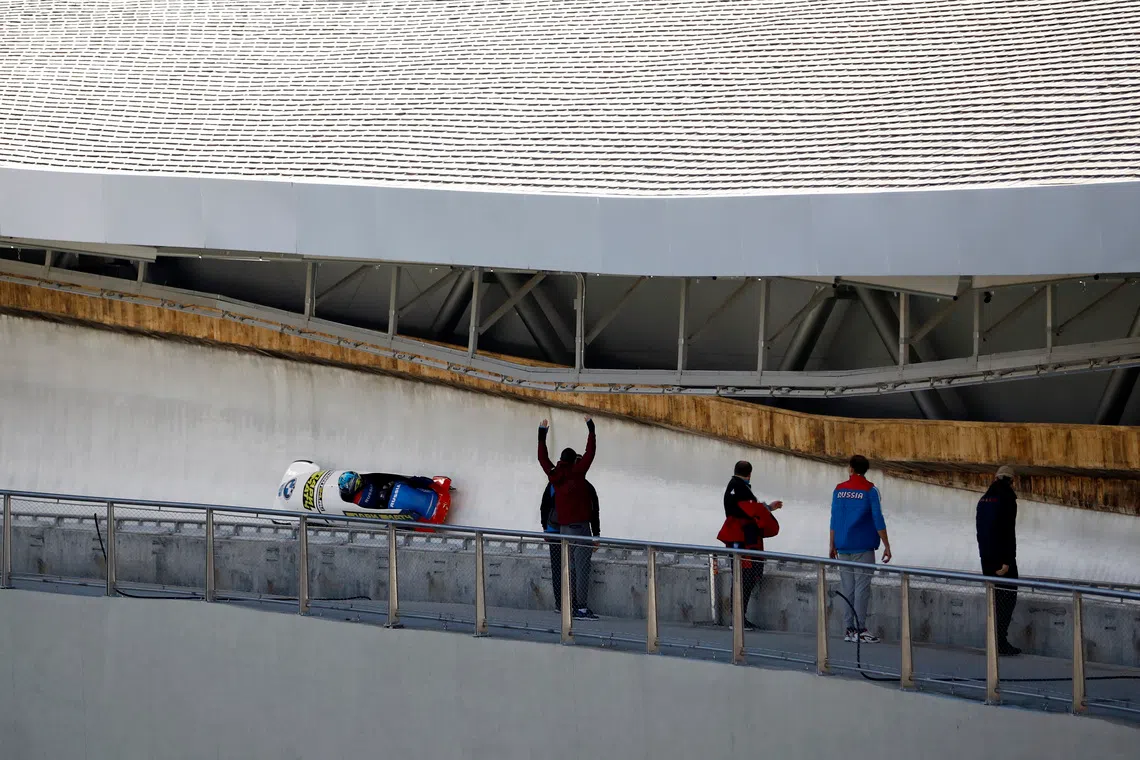 Skeleton - Beijing 2022 Winter Olympics Test Event - IBSF Bobsleigh International Sanctioned Race - Yanqing National Sliding Center, Yanqing, China - October 26, 2021 Russia's Lubov Chernykh and Elena Mamedova in action during the Women's 2-Woman bobsleigh REUTERS/Tingshu Wang