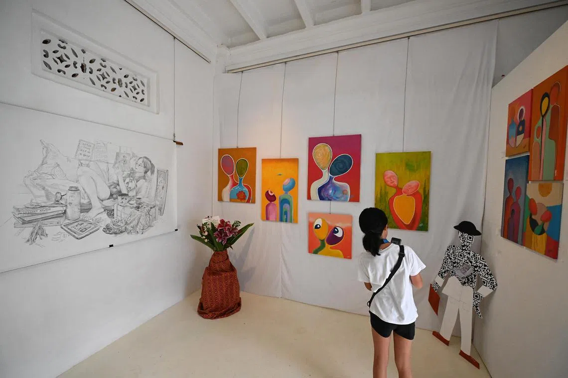 (Far left) 'Still Alive' by Grace Chen and (right) acrylic on canvas by Pierre Pourville .