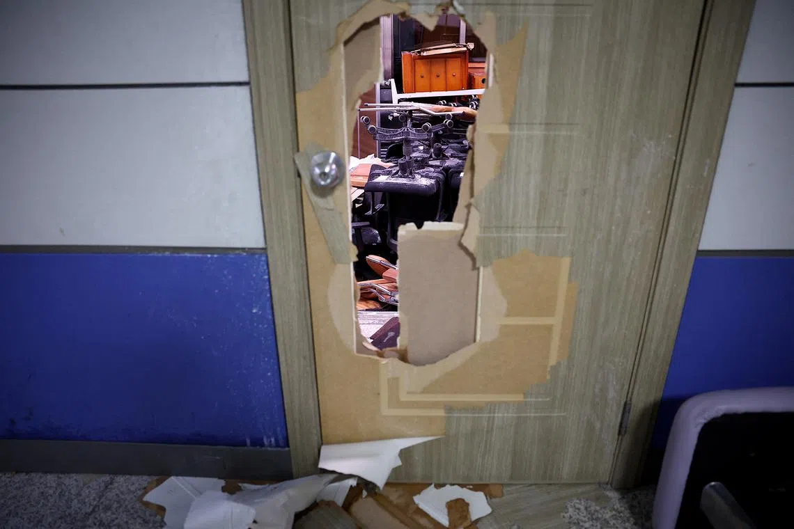 Furniture is piled up behind a door which was damaged when military forces broke into the National Assembly building, after South Korean President Yoon Suk Yeol declared martial law, in Seoul, South Korea, Dec 4, 2024. 