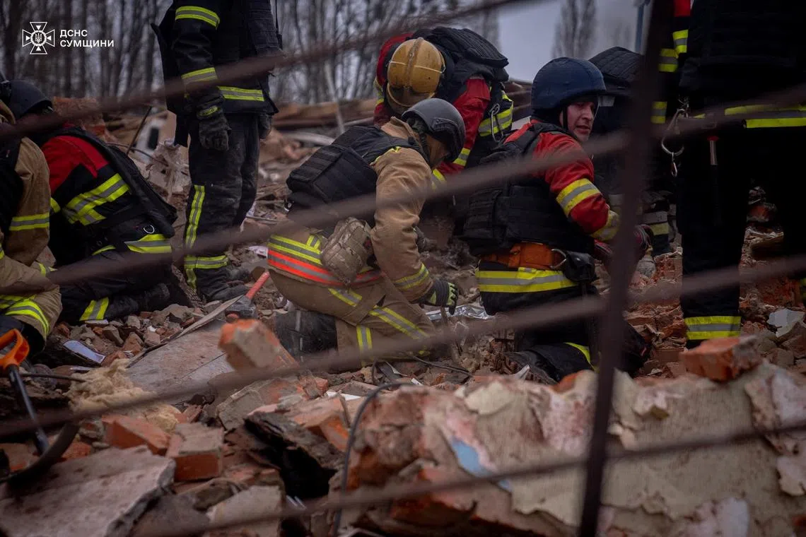 Rescuers removes debris as they search for people at the site of a Russian military strike, amid Russia's attack on Ukraine, in Sumy, Ukraine November 26, 2024. Press service of the State Emergency Service of Ukraine in Sumy region/Handout via REUTERS ATTENTION EDITORS - THIS IMAGE HAS BEEN SUPPLIED BY A THIRD PARTY. DO NOT OBSCURE LOGO.