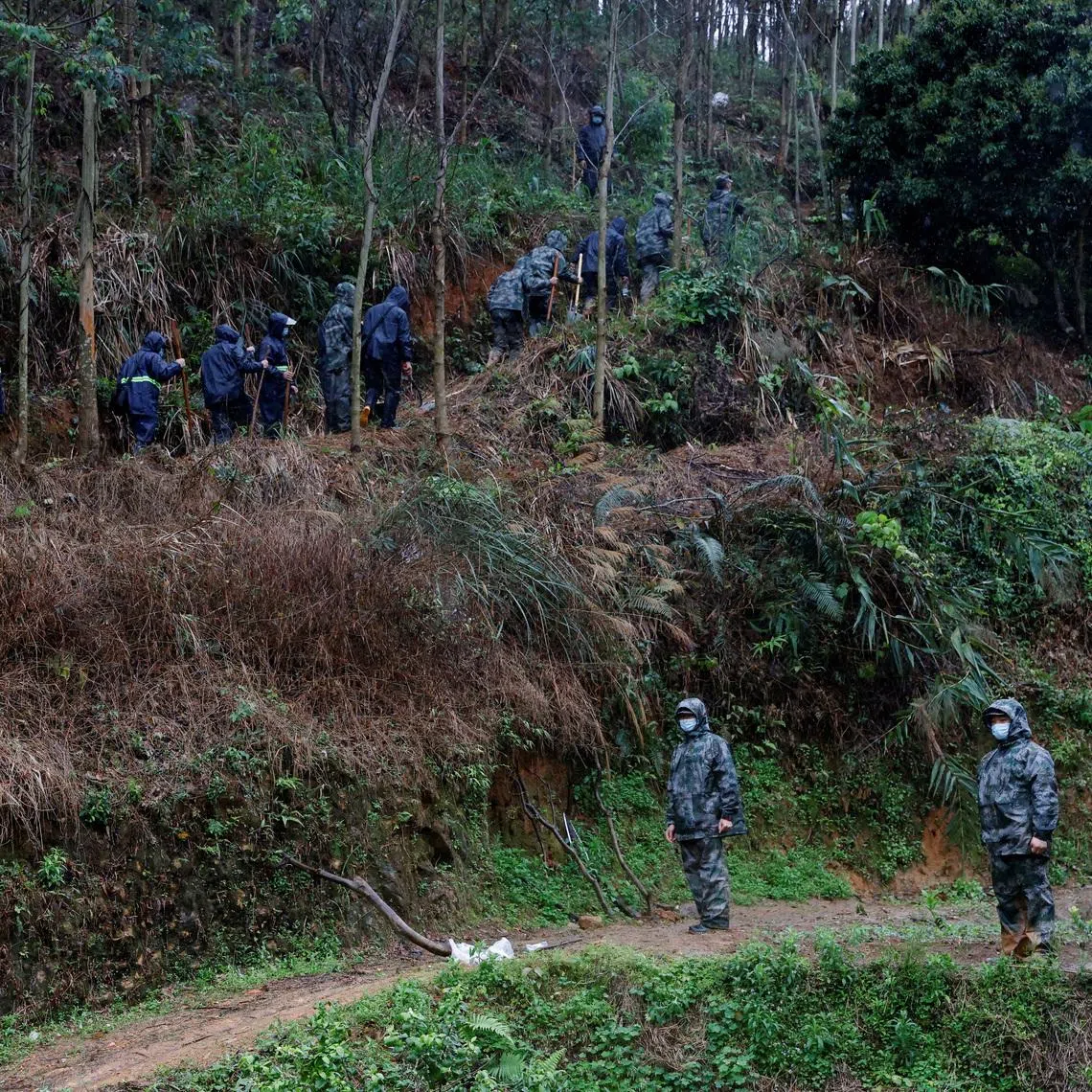 Rescue workers work at the site where a China Eastern Airlines Boeing 737-800 plane flying from Kunming to Guangzhou crashed, in Wuzhou, Guangxi Zhuang Autonomous Region, China March 24, 2022.