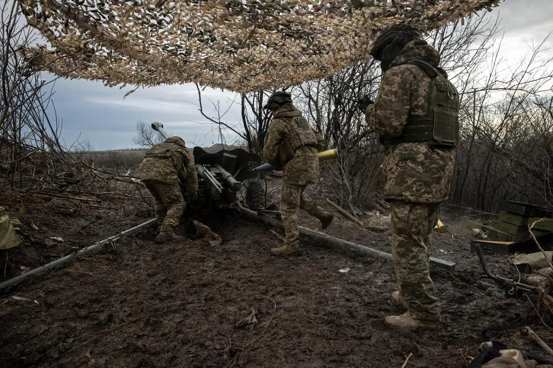 Ukrainian soldiers fire at Russian positions in the direction of Bakhmut.