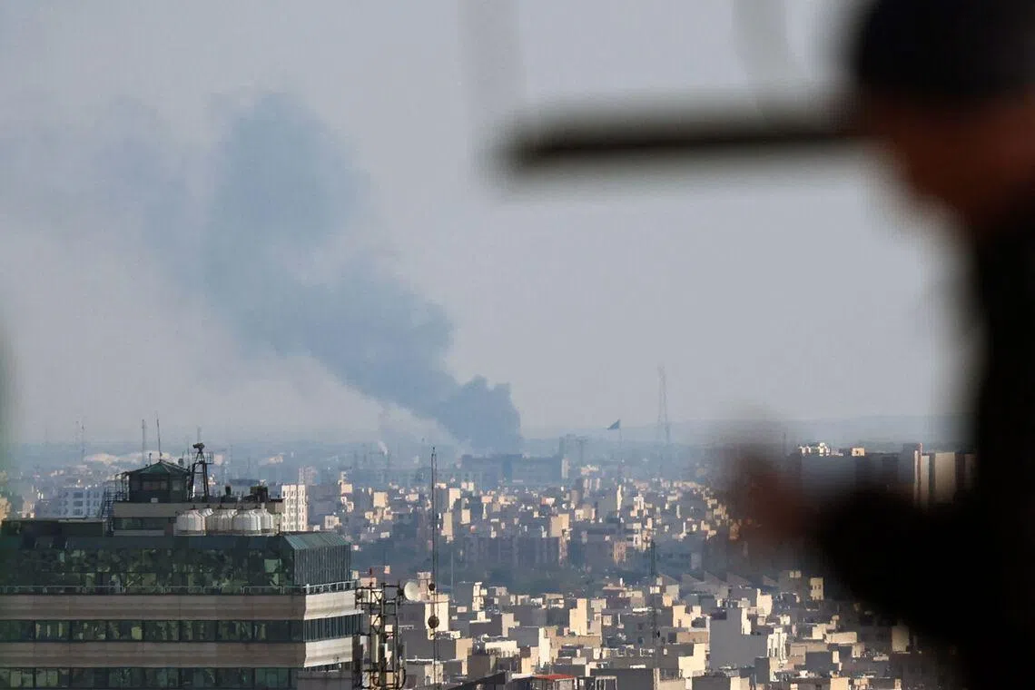 Smoke rises from the site of a strike in Tehran on April 1, 2026. 