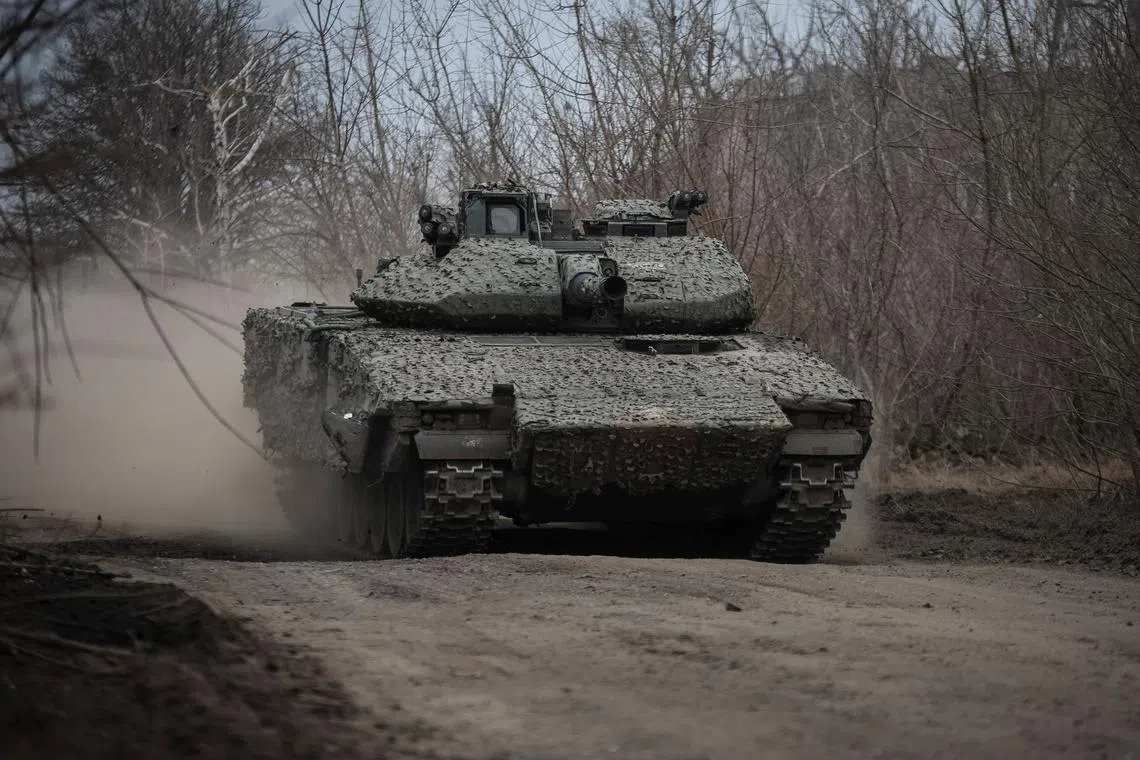 FILE PHOTO: A Ukrainian CV-90 infantry fighting vehicle is driven, amid Russia's attack on Ukraine, near the frontline town of Chasiv Yar in Donetsk region, Ukraine March 5, 2024. REUTERS/Oleksandr Ratushniak/File Photo