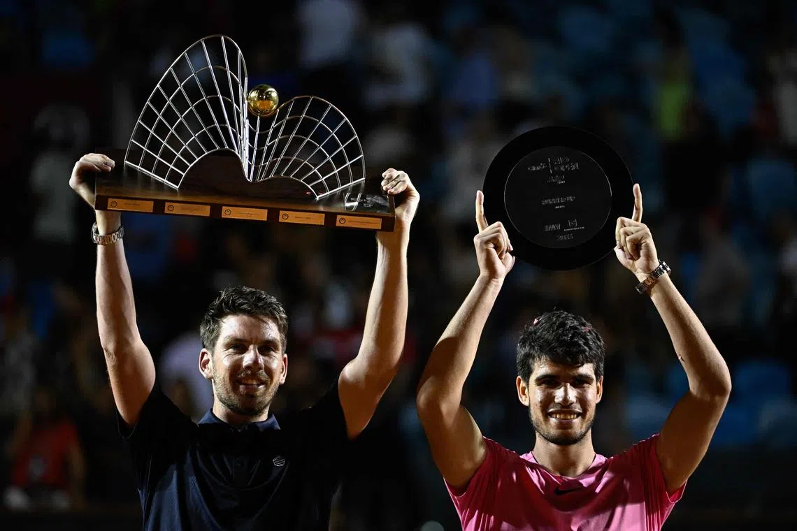 Britain's Cameron Norrie (left) posing with the trophy next to Carlos Alcaraz after defeating the Spaniard in the Rio Open final.