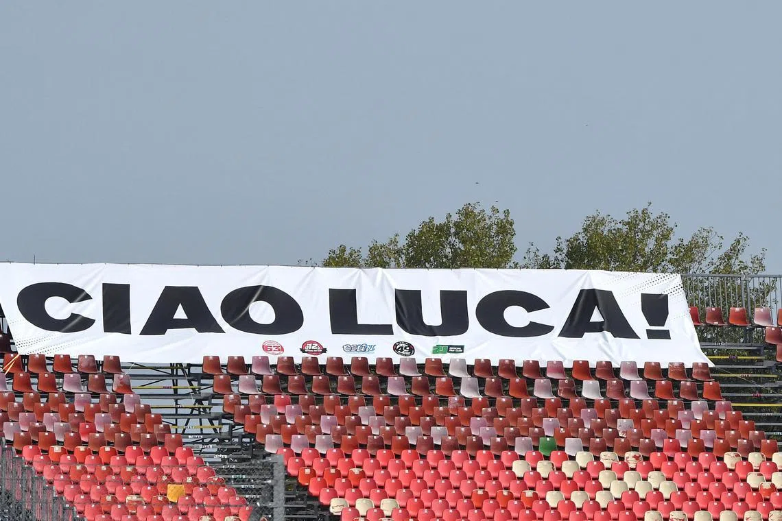 In Italy a banner flies in memory of motorcycle racer Luca Salvadori who died after a crash. 