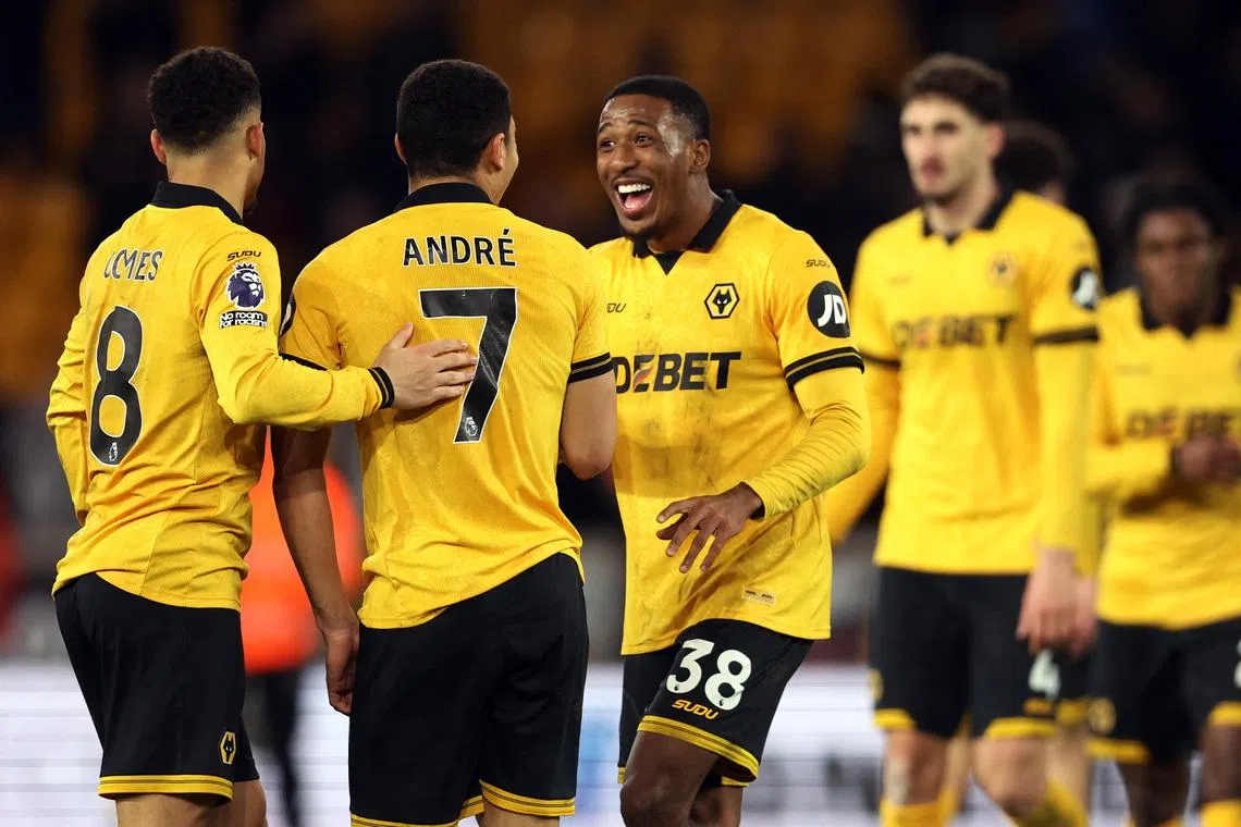 Soccer Football - Premier League - Wolverhampton Wanderers v Liverpool - Molineux Stadium, Wolverhampton, Britain - March 3, 2026 Wolverhampton Wanderers' Andre, Joao Gomes and Jackson Tchatchoua celebrate after the match REUTERS/Chris Radburn