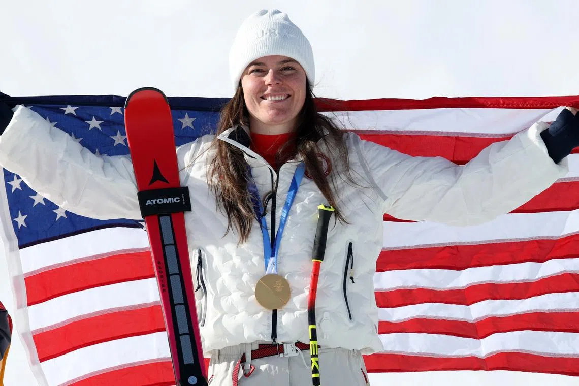 Milano Cortina 2026 Olympics - Alpine Skiing - Women's Downhill Victory Ceremony - Tofane Alpine Skiing Centre, Belluno, Italy - February 08, 2026. Gold medallist Breezy Johnson of United States celebrates after winning the women's downhill REUTERS/Leonhard Foeger