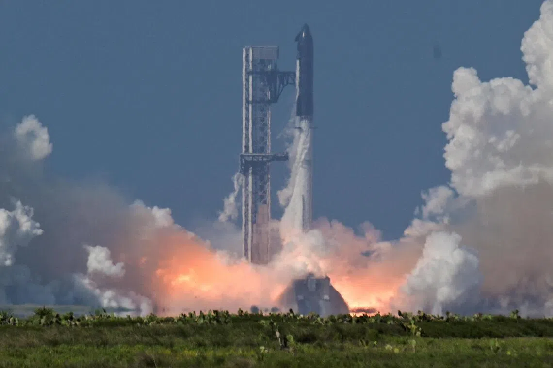 A SpaceX Super Heavy booster carrying the Starship spacecraft lifts off on its 12th test flight at Starbase, Texas, on May 22.