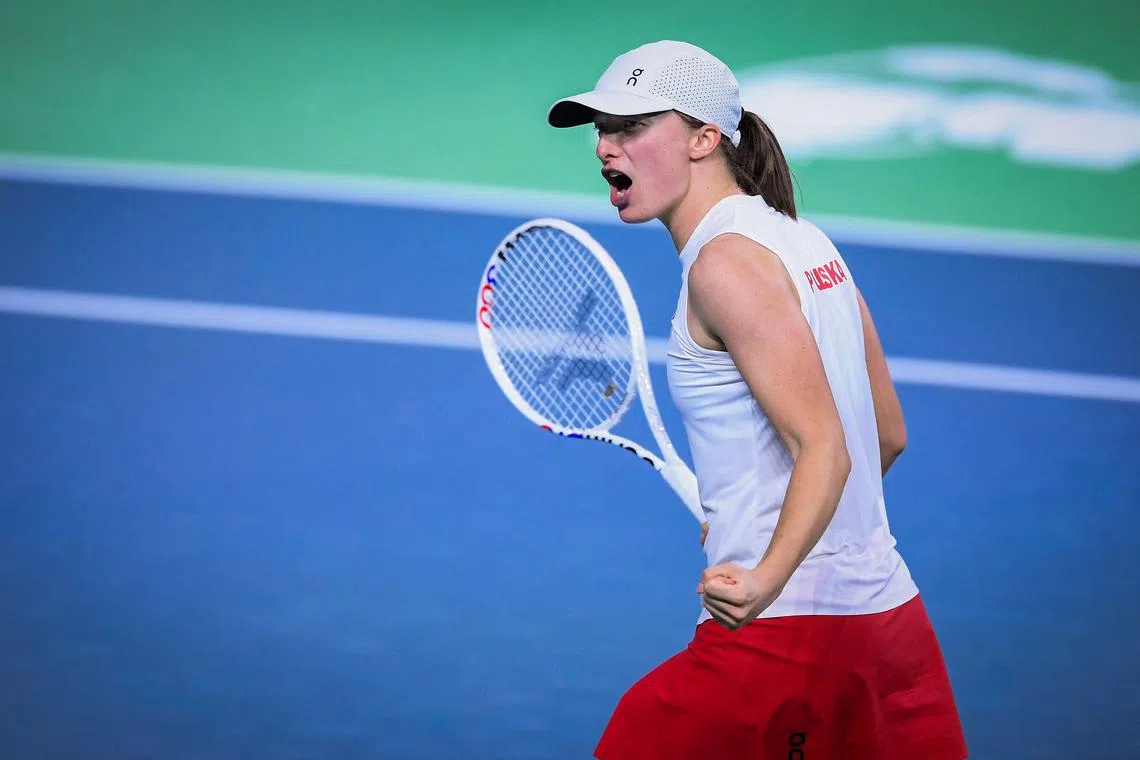Poland's Iga Swiatek celebrating after winning her match against Spain's Paula Badosa during the singles tennis match between Spain and Poland at the Billie Jean King Cup Finals at the Palacio de Deportes Jose Maria Martin Carpena in Malaga on Nov 15.