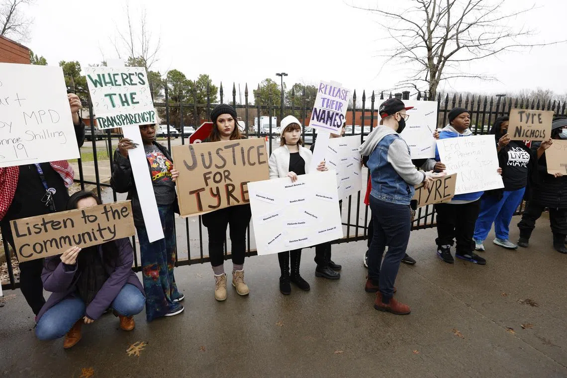 Protesters on Sunday hold signs outside the Memphis Police Department's Ridgeway Station two days after the release of video footage showing the encounter earlier this month between Tyre Nichols, 29, and five Memphis police officers which resulted in Nichols' beating and subsequent death. Nichols, who was stopped by Memphis police on Jan 7 for reckless driving, died three days after the incident from injuries sustained when the officers involved, who have all been fired and charged with murder, beat him after his arrest.  