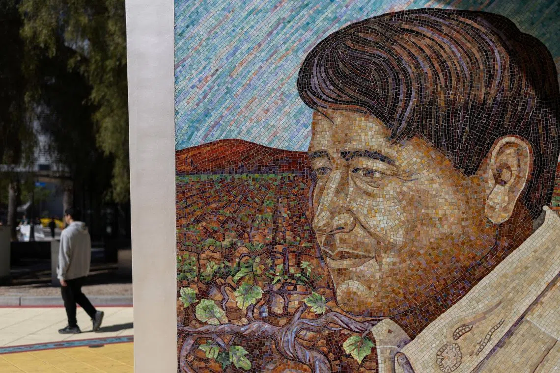 A person walks near a mural of Cesar Chavez after civil rights leader Dolores Huerta, who co-founded the United Farm Workers union with Cesar Chavez and fought alongside him for decades to expand labor rights in the U.S. accused Chavez of sexually assaulting her in the 1960s, at San Jose University campus in San Jose, California, U.S. March 18, 2026. REUTERS/ Carlos Barria