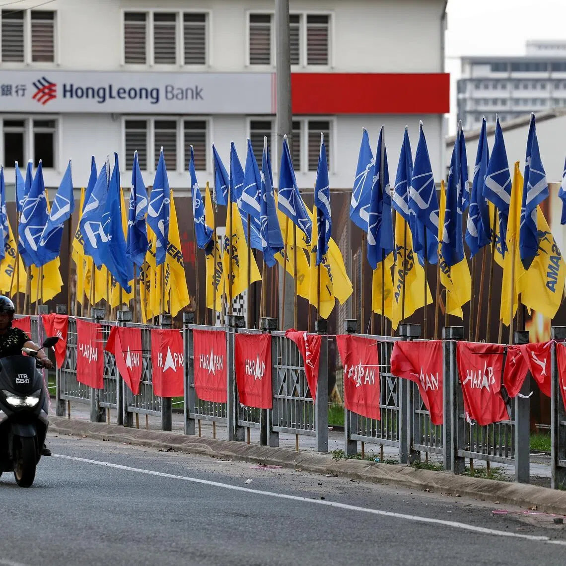 Flags of the Pakatan Harapan and Barisan Nasional blocs lining a street in Johor ahead of the state’s July 11 polls.