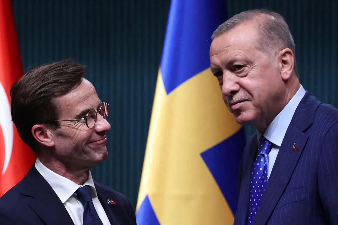 Swedish Prime Minister Ulf Kristersson (left) shakes hands with Turkish President Recep Tayyip Erdogan, during a meeting in Ankara in November 2022.