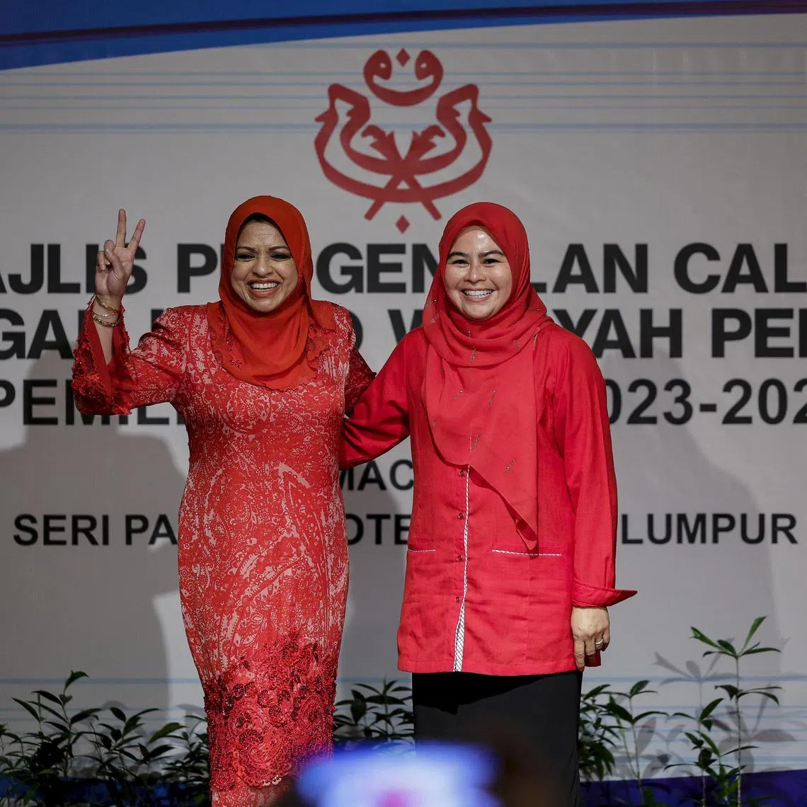 Incumbent Women’s wing leader Noraini Ahmad (right) retained her leadership of the wing, despite a stiff challenge from her predecessor Shahrizat Abdul Jalil.