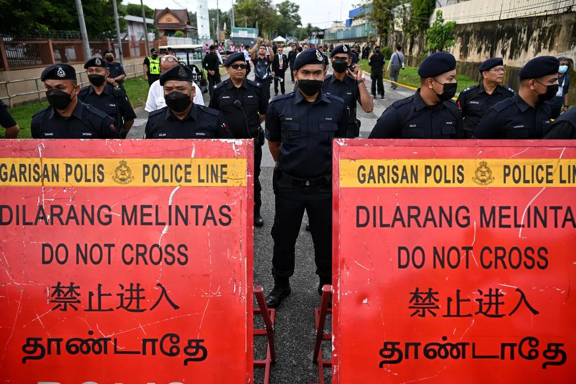 Police on standby during Nomination Day of Malaysia's 15th General Election held at the Industrial Training Institute (ILP Ipoh) in Tambun, Perak on 5 Nov 2022.