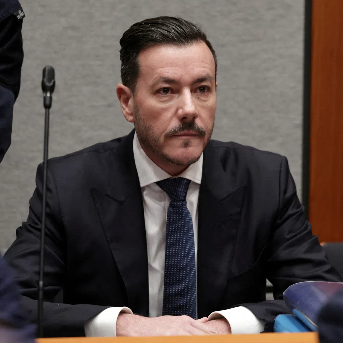 FILE PHOTO: Austrian former billionaire Rene Benko waits for the start of his trial, in the first case tackling the collapse of his property group Signa, in a courtroom in Innsbruck, Austria, October 15, 2025. REUTERS/Leonhard Foeger/File Photo