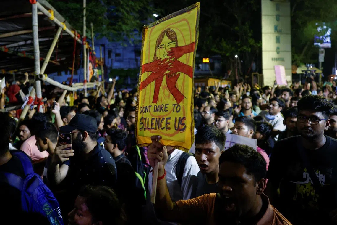 A medical student carries a placard, as he walks along with doctors and paramedics to join a protest against what they say is rape and murder of a trainee doctor, inside the premises of R G Kar Medical College and Hospital in Kolkata, India, August 12, 2024. REUTERS/Sahiba Chawdhary