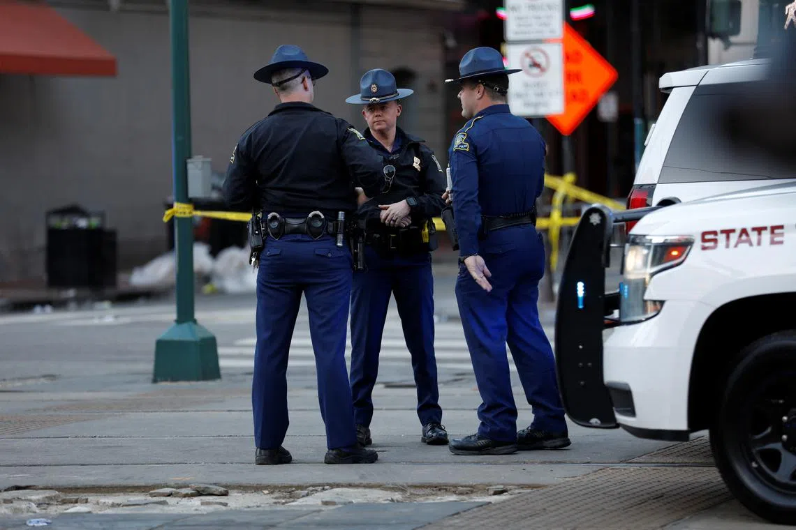 Louisiana State Troopers stand near the site where people were killed by a man driving a truck in an attack during New Year's celebrations, in New Orleans, Louisiana, U.S. January 1, 2025.  REUTERS/Octavio Jones