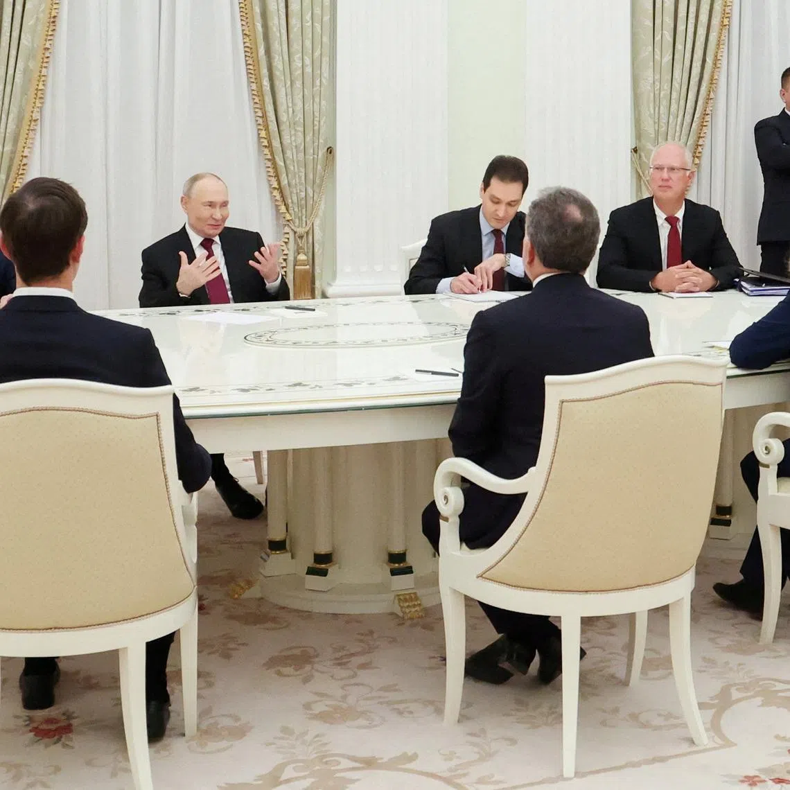 FILE PHOTO: Russian President Vladimir Putin, presidential envoy Kirill Dmitriev and foreign policy aide Yuri Ushakov attend a meeting with U.S. President Donald Trump's special envoy Steve Witkoff and son-in-law Jared Kushner at the Kremlin in Moscow, Russia, December 2, 2025. Sputnik/Alexander Kazakov/Pool via REUTERS/File Photo