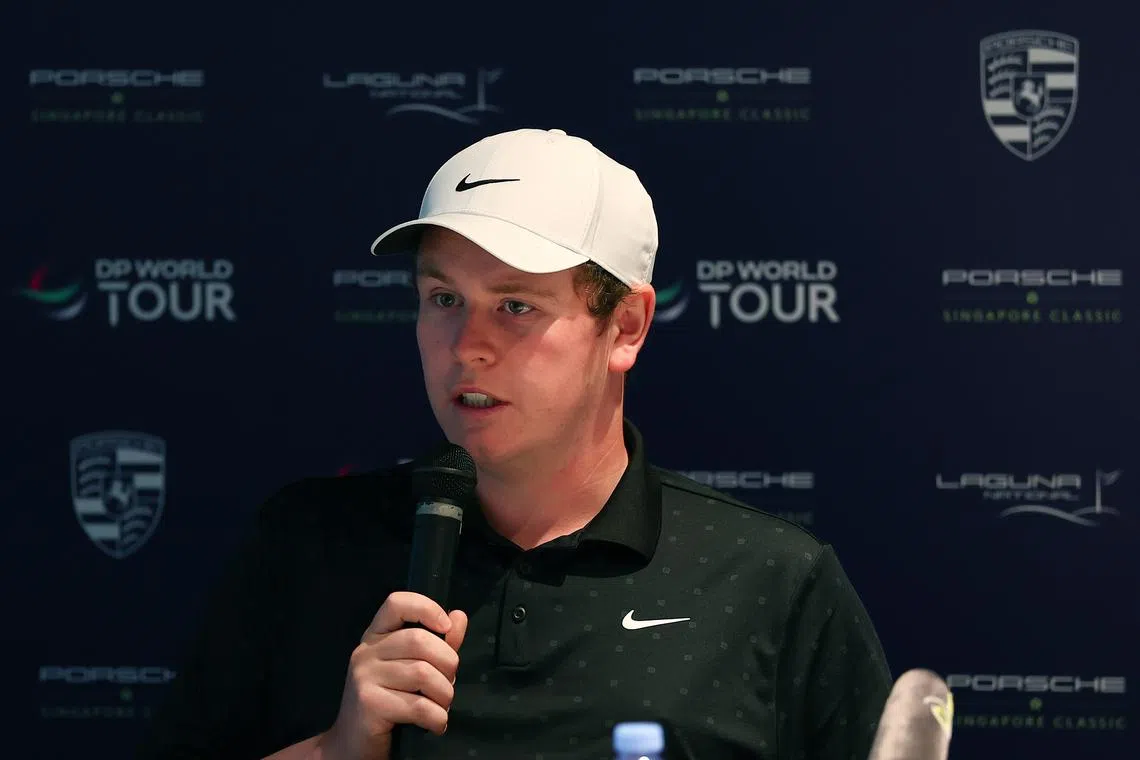 SINGAPORE, SINGAPORE - MARCH 19: Robert Macintyre of Scotland speaks to the media prior to the Porsche Singapore Classic 2025 at Laguna National Golf Resort Club on March 19, 2025 in Singapore, Singapore. (Photo by Pakawich Damrongkiattisak/Getty Images)