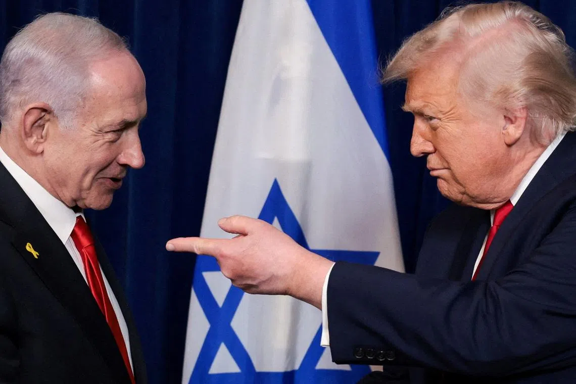 FILE PHOTO: U.S. President Donald Trump points his finger towards Israeli Prime Minister Benjamin Netanyahu during a press conference after meeting at Trump’s Mar-a-Lago club in Palm Beach, Florida, U.S., December 29, 2025. REUTERS/Jonathan Ernst/File Photo