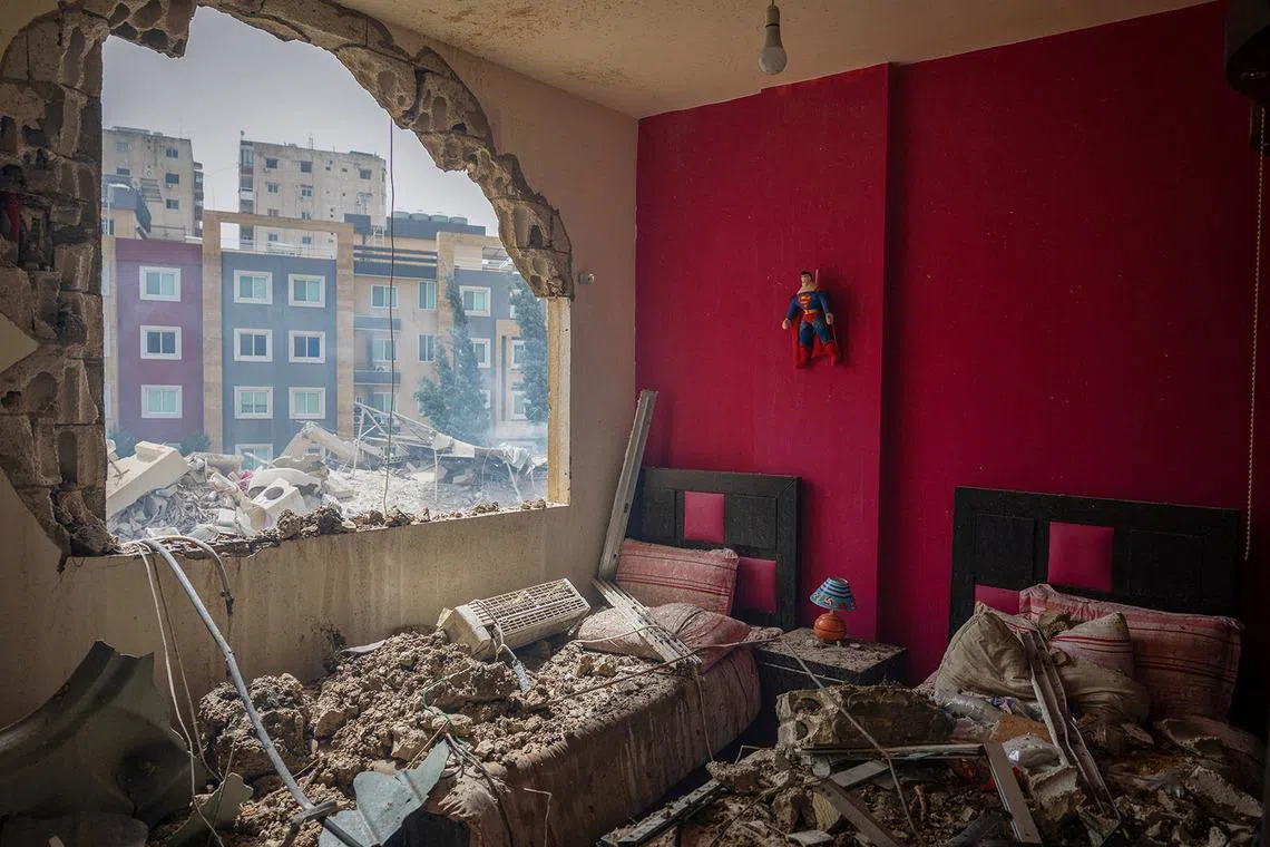A Superman figure hangs on a wall in a room at a house damaged in an Israeli airstrike, amid escalating hostilities between Israel and Hezbollah, as the U.S.-Israeli conflict with Iran continues, in Tyre, Lebanon, April 4, 2026. REUTERS/Adnan Abidi TPX IMAGES OF THE DAY