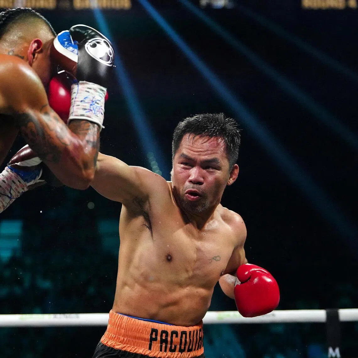 Manny Pacquiao throwing a punch at Mario Barrios at MGM Grand Garden Arena in Las Vegas on July 19, 2025. The fight ended in a majority draw.