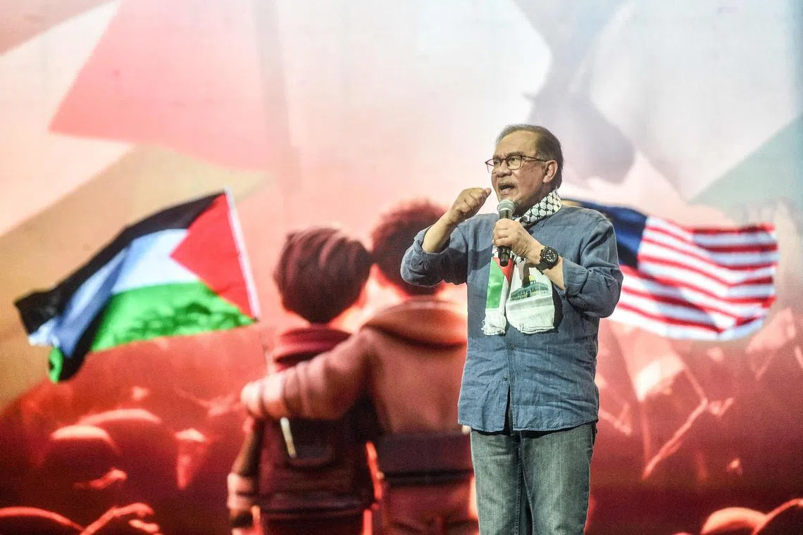 Malaysia's Prime Minister Anwar Ibrahim delivers a speech during a pro-Palestinian rally in Kuala Lumpur on August 4, 2024. (Photo by Arif Kartono / AFP)