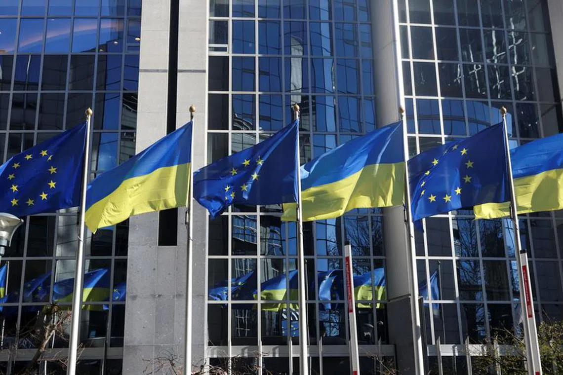 Flags of European Union and Ukraine flutter outside EU Parliament building, in Brussels, Belgium, February 28, 2022.  REUTERS/Yves Herman/ File Photo