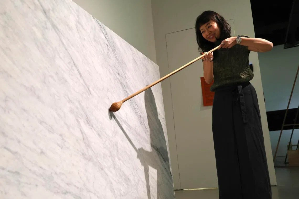 Filipino artist Gary-Ross Pastrana’s Water Cuts (stone) lets visitors pour saltwater over a slab of marble.