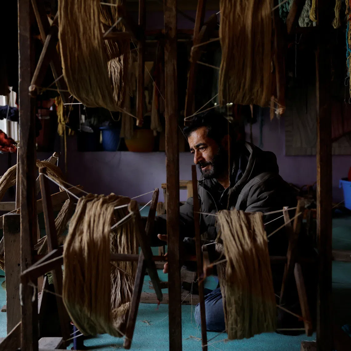 Former carpet weaver Gulzar Ahmad Bhat abandoned his craft of 35 years and now sells tea on the shores of Dal Lake.