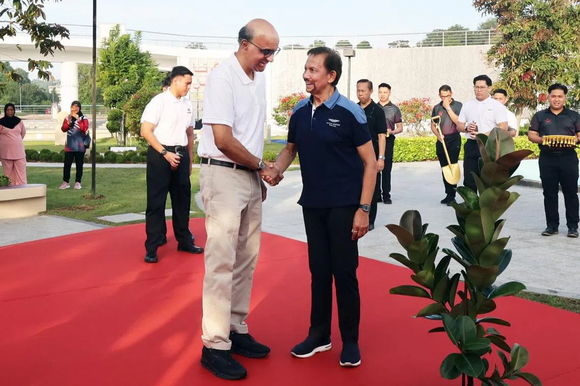 President Tharman Shanmugaratnam and Brunei’s Sultan Hassanal Bolkiah at a tree planting ceremony at the Taman Mahkota Jubli Emas park in Bander Seri Begawan on Jan 26.