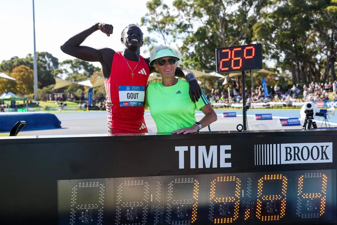 Gout Gout and his coach Di Sheppard with his time of 19.84 in winning the men's 200m at the Australian Athletics Championships in Perth on April 13, 2025. It was wind-assisted and will not count as a national record.
