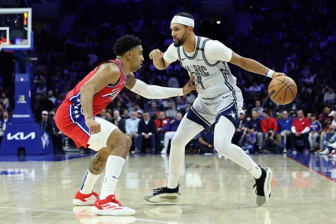 Jalen Suggs of the Orlando Magic drives against KJ Martin of the Philadelphia 76ers at the Wells Fargo Centre on Dec 6, 2024.