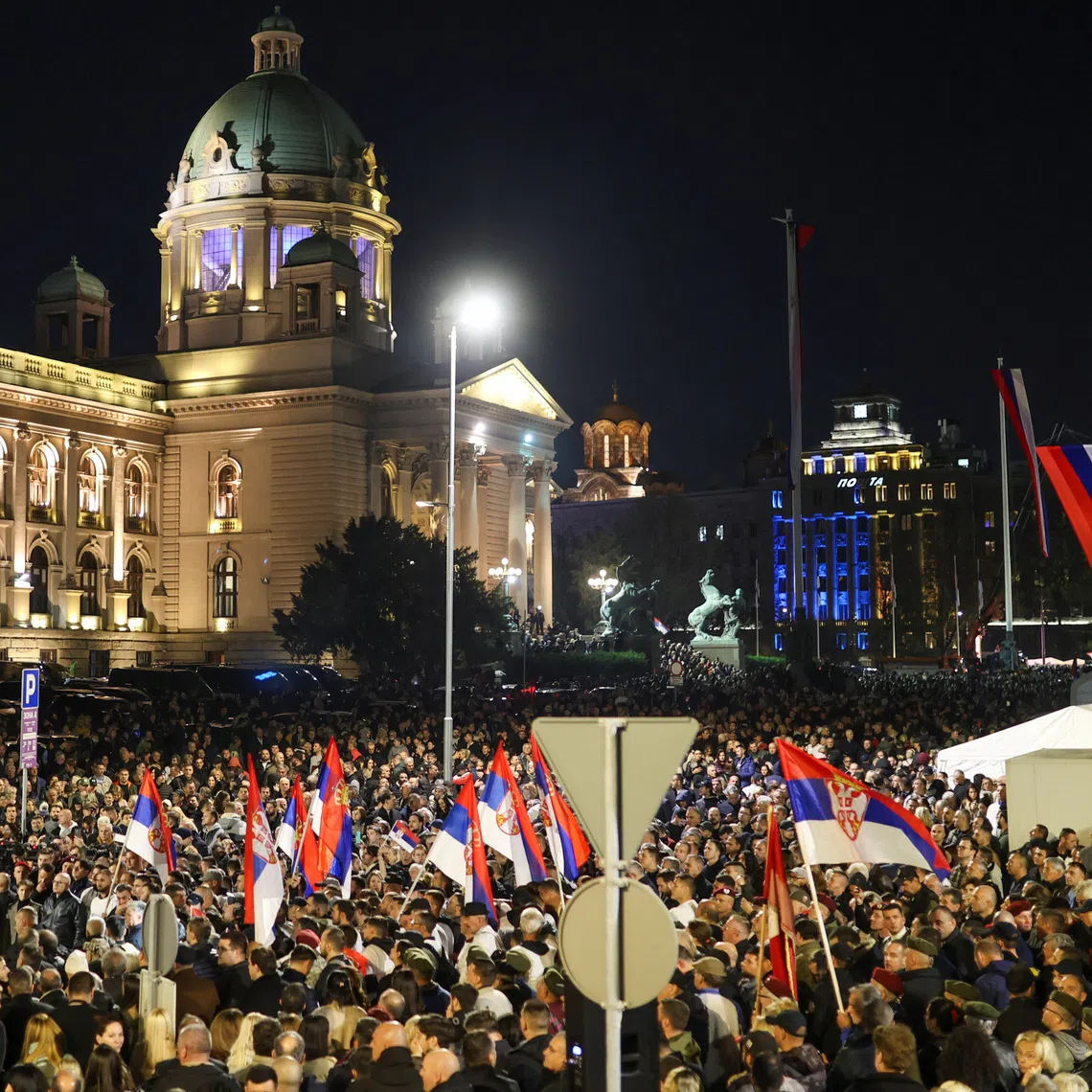 Supporters of Serbian President Aleksandar Vucic take part in a demonstration near the tents where student protesters are staying with the mother of one of the victims of the fatal November 2024 railway station canopy collapse, who is on a hunger strike, in Belgrade, Serbia, November 5, 2025. REUTERS/Djordje Kojadinovic
