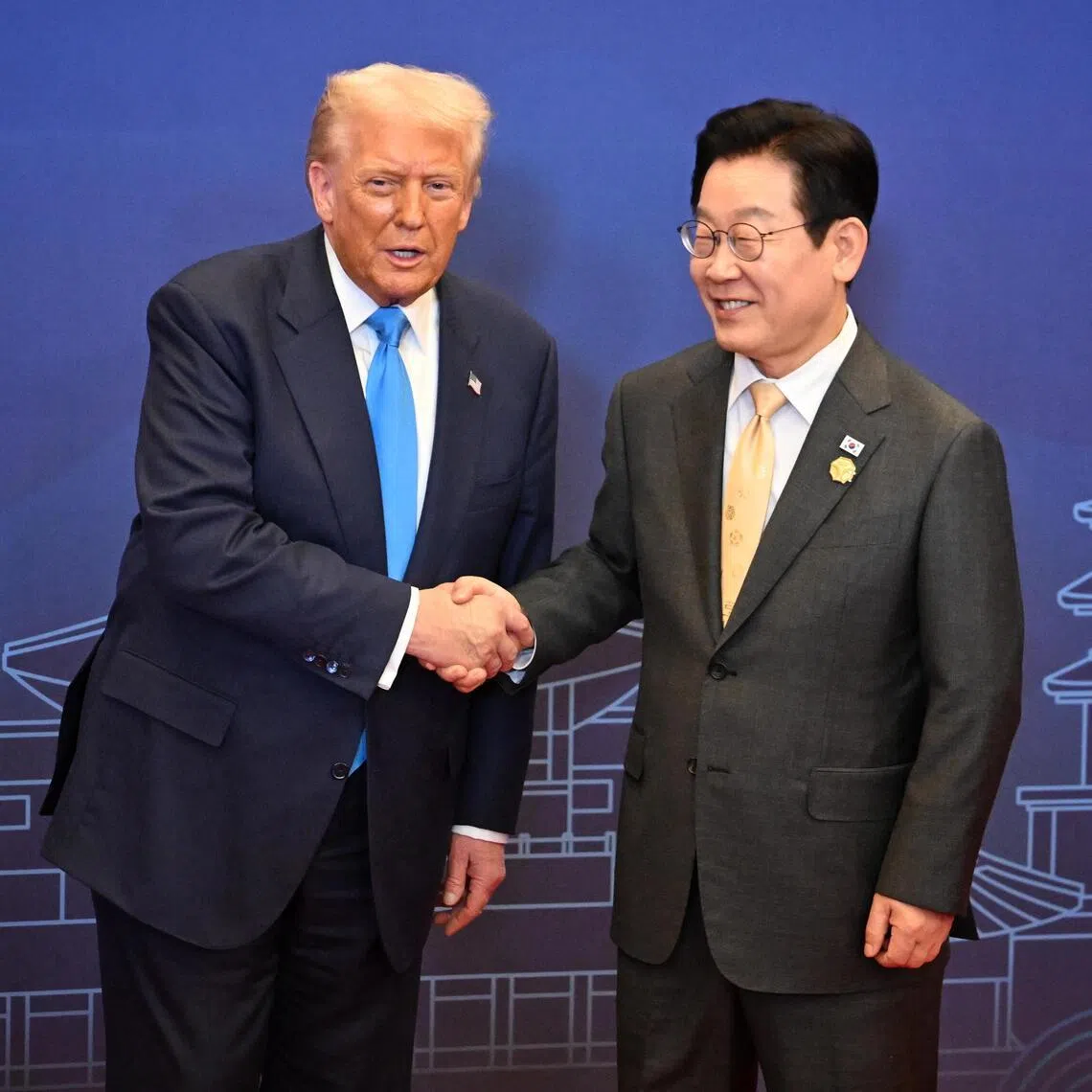 From left: US President Donald Trump shakes hands with South Korea President Lee Jae Myung at the special dinner at APEC 2025 in Gyeongju, South Korea on Oct 29, 2025.
