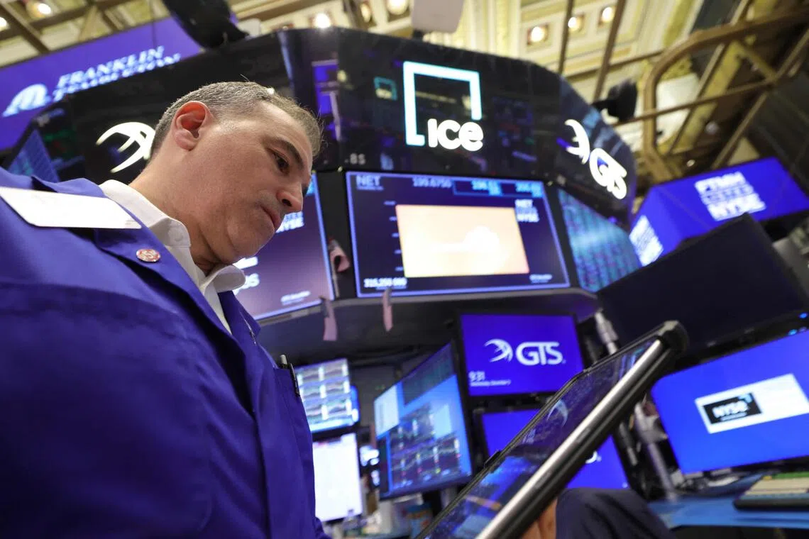 Traders working on the floor of the New York Stock Exchange at the opening bell on Dec 3, in New York City.
