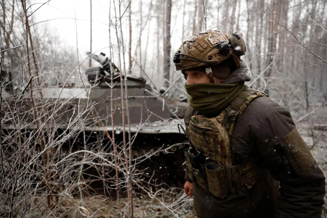 Ukrainian commander Vyshnia “Cherry” walks at the front line in Kreminna, Ukraine, during Orthodox Christmas.