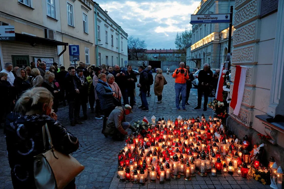 Mourners hold a vigil for Polish aid worker Damian Sobol who was killed in an Israeli air strike in Gaza. 