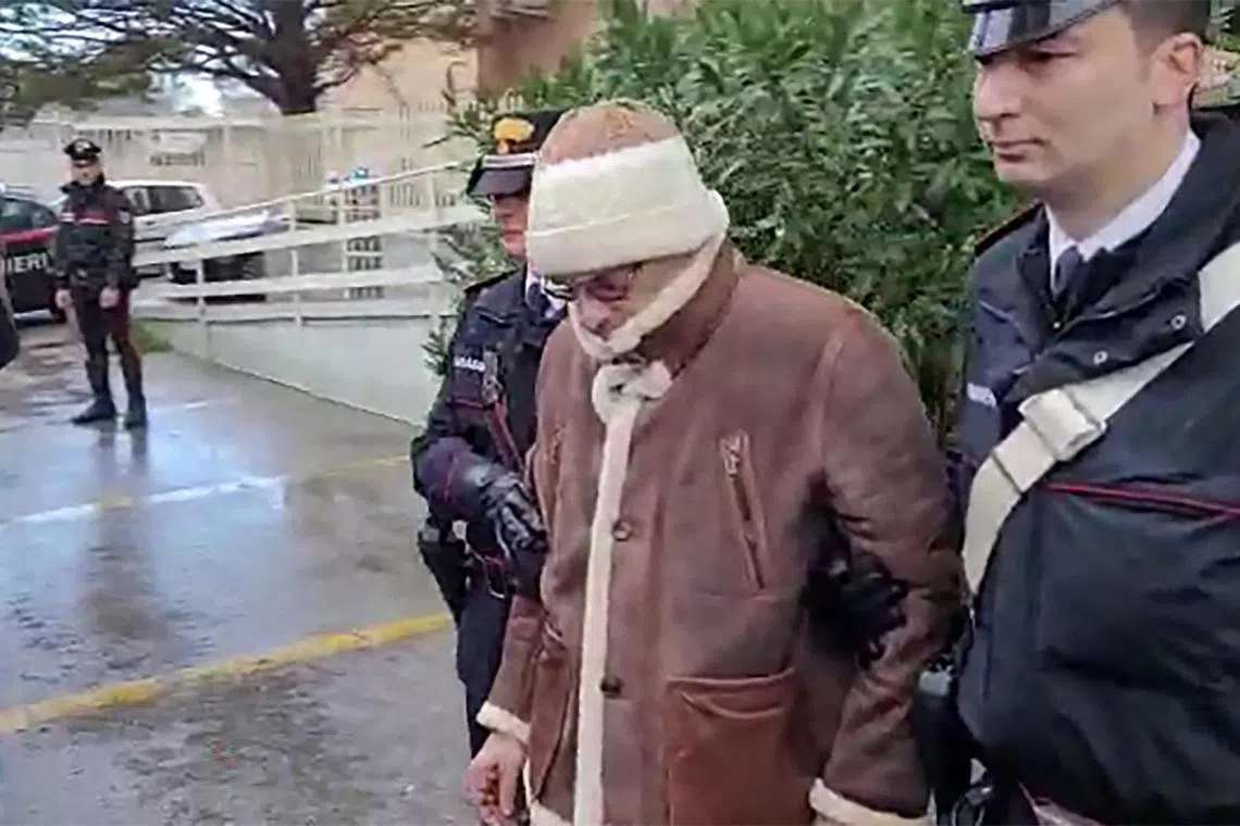 This handout video grab shows the arrest of Italy's top wanted mafia boss, Matteo Messina Denaro, in his native Sicily after 30 years on the run. 