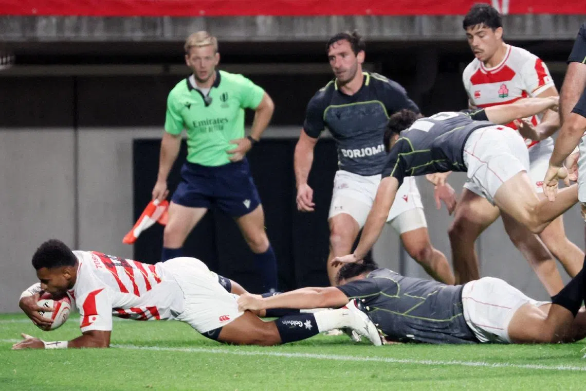 Japan's Jone Naikabula scores a try during the international rugby Test match between Japan and Georgia on July 13, 2024. 