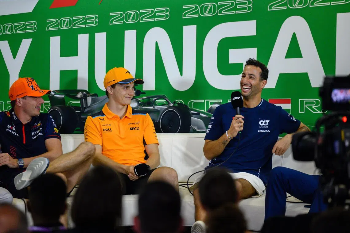 AlphaTauri's Daniel Ricciardo (far right) takes part in the drivers' press conference ahead of the Hungarian grand prix, with Red Bull's Max Verstappen (left) and McLaren's  Oscar Piastri.