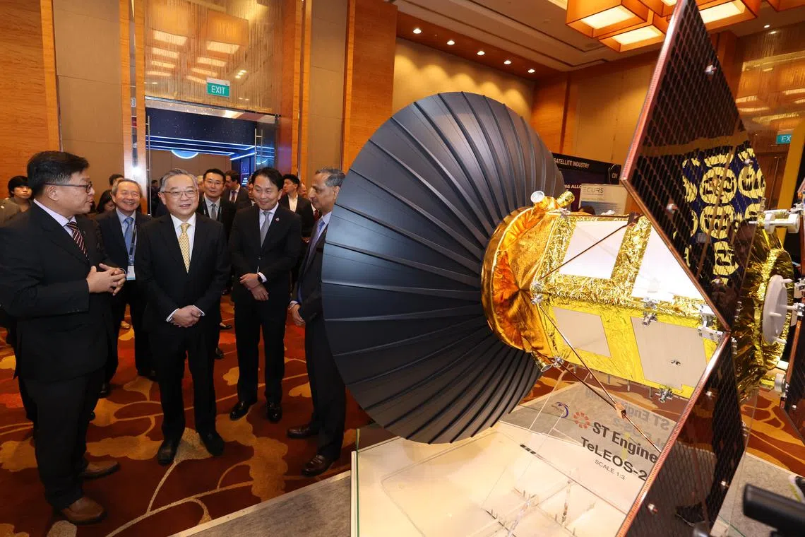 Deputy Prime Minister and Minister for Trade and Industry Gan Kim Yong (in yellow tie) at the 17th Global Space Technology Convention and Exhibition on Feb 26.