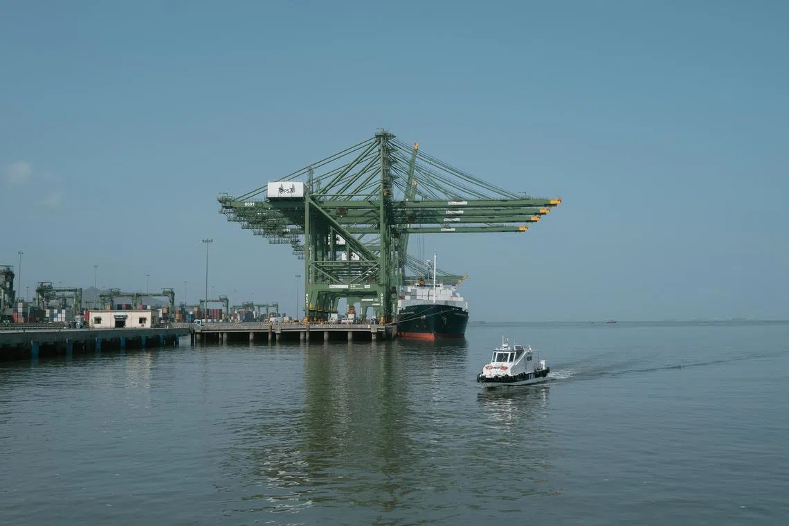 -- EMBARGO: NO ELECTRONIC DISTRIBUTION, WEB POSTING OR STREET SALES BEFORE 12:01 A.M. ET ON TUESDAY, AUG. 20, 2024. NO EXCEPTIONS FOR ANY REASONS -- Cranes load and unload the containers of a ship at a terminal at the Jawaharlal Nehru Port, just south of Mumbai, on the west coast of India, May 31, 2024. Efforts to build new ports and expand existing docks could determine whether India emerges as a legitimate option for global factory production. (Elke Scholiers/The New York Times)