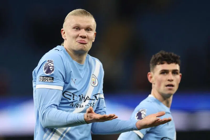 Manchester City's striker Erling Haaland (left) gestures to the West Ham fans at the end of the match.