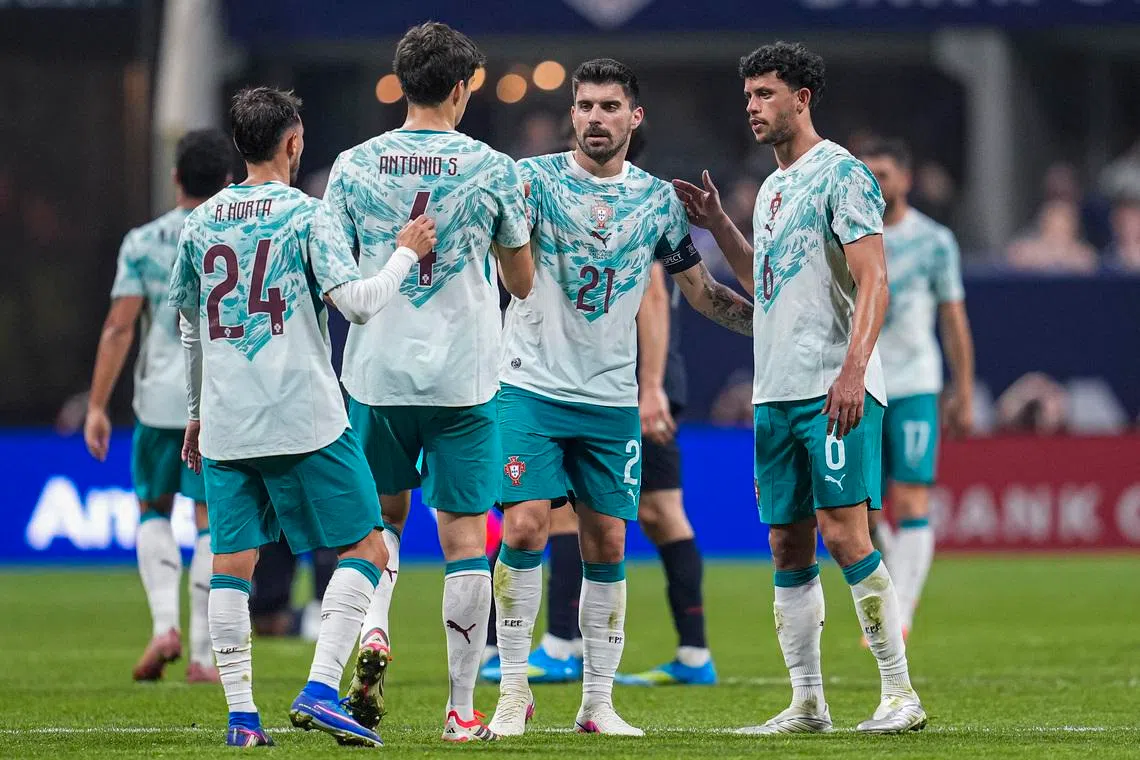 Mar 31, 2026; Atlanta, Georgia, USA; Portugal players react with teammates and United States players after the match at Mercedes-Benz Stadium. Mandatory Credit: Dale Zanine-Imagn Images