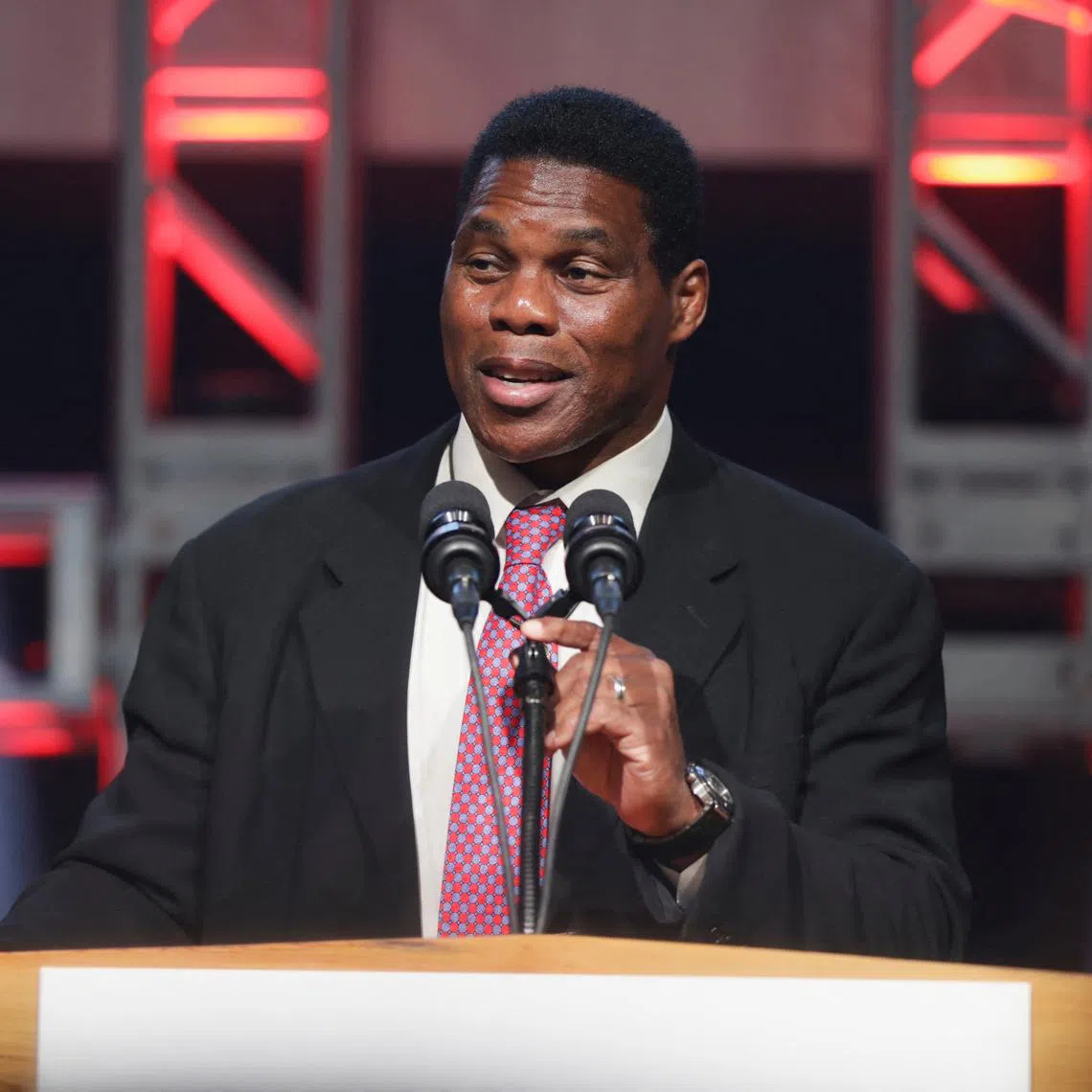 FILE PHOTO: Republican U.S. Senate candidate Herschel Walker speaks during a U.S. midterm runoff election night party in Atlanta, Georgia, U.S., December 6, 2022. REUTERS/Alyssa Pointer/File Photo