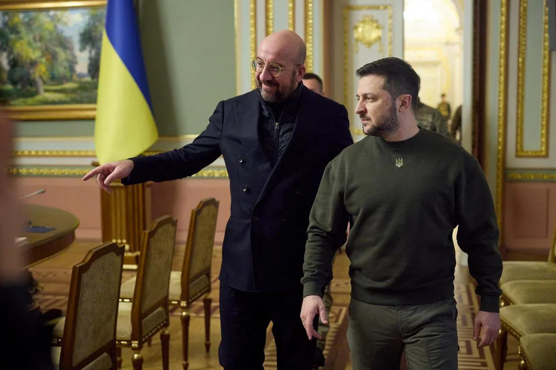 Ukraine's President Volodymyr Zelensky (front) welcomes European Council president Charles Michel to Kyiv, on Jan 19, 2023.